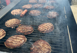 Parishioners enjoy the first cookout during the Summer of Fun